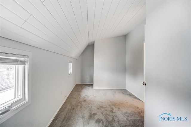 bonus room featuring light carpet, wooden ceiling, and lofted ceiling