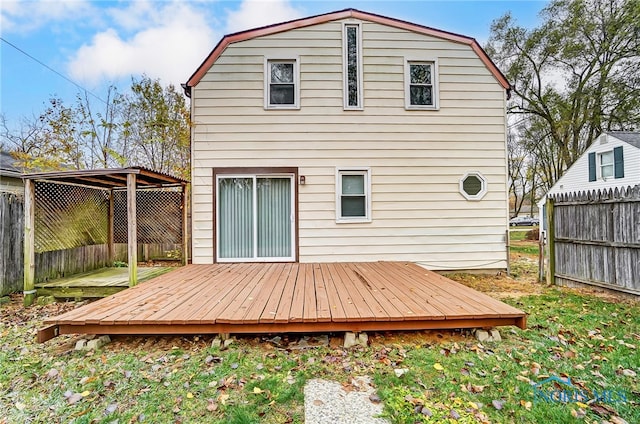 rear view of property featuring a deck