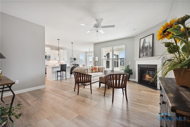 3343 Moonlit Pass, Monclova, OH 43542 - living room featuring ceiling fan and light hardwood / wood-style flooring
