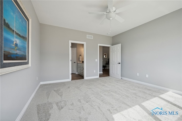 3343 Moonlit Pass, Monclova, OH 43542 - unfurnished bedroom featuring carpet floors, ensuite bathroom, and ceiling fan