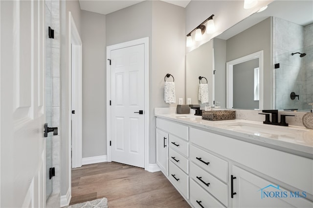 3343 Moonlit Pass, Monclova, OH 43542 - bathroom with vanity, wood-type flooring, and a shower with door