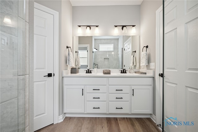 3343 Moonlit Pass, Monclova, OH 43542 - bathroom featuring vanity, an enclosed shower, and wood-type flooring