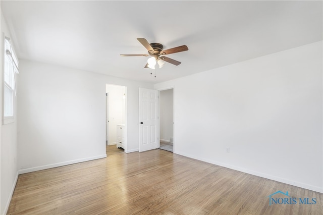 spare room featuring ceiling fan and light wood-type flooring