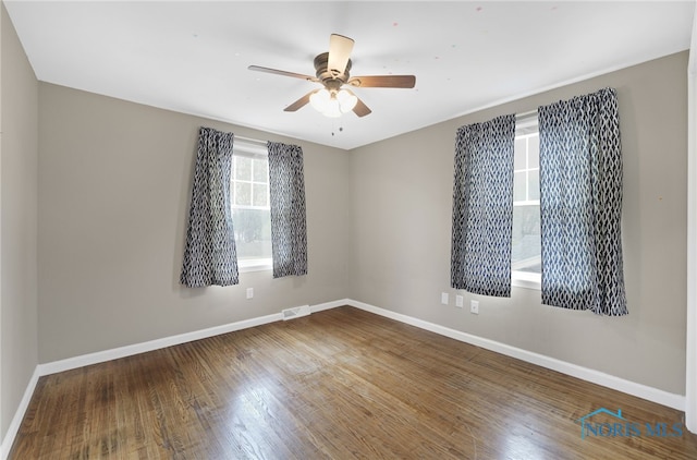 unfurnished room featuring ceiling fan and wood-type flooring