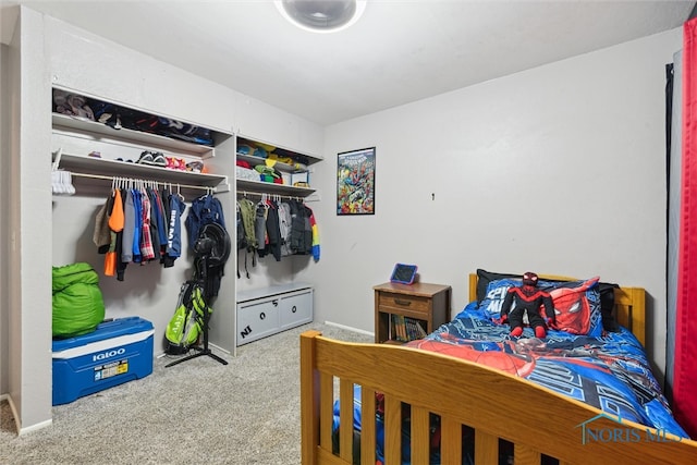 carpeted bedroom featuring a closet