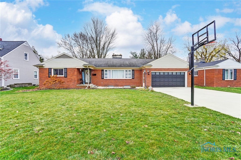 ranch-style house with a garage and a front lawn