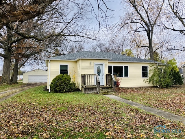 view of front of home with an outbuilding and a garage