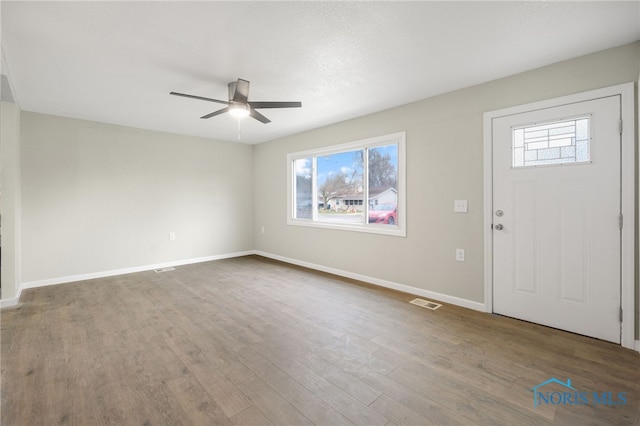 foyer featuring ceiling fan and hardwood / wood-style flooring