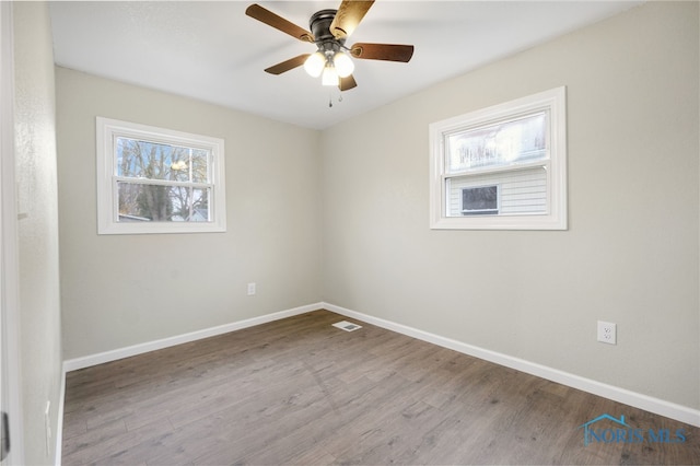 spare room with ceiling fan and light hardwood / wood-style flooring