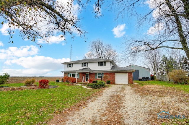 view of front property with a porch, a garage, and a front yard