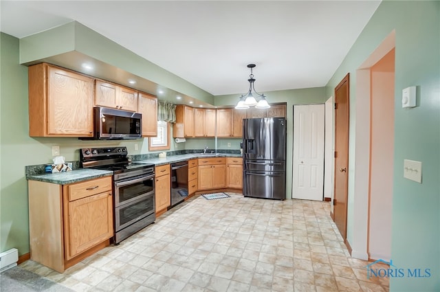 kitchen featuring appliances with stainless steel finishes, light brown cabinets, pendant lighting, and sink