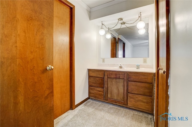 bathroom with vanity and crown molding