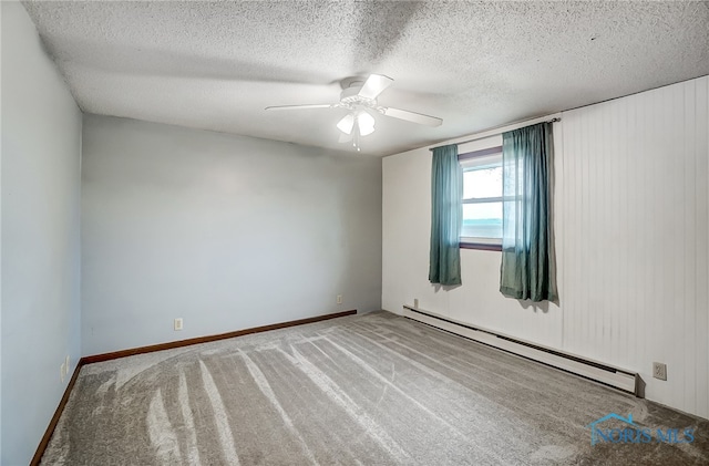 carpeted spare room featuring a textured ceiling, a baseboard radiator, and ceiling fan