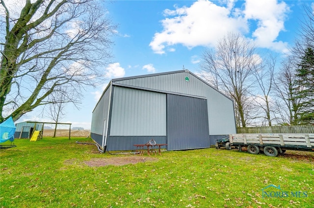 view of outdoor structure featuring a yard