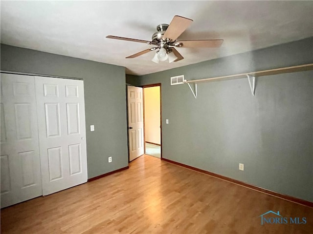 unfurnished bedroom with ceiling fan and light hardwood / wood-style flooring