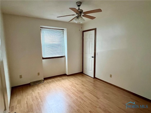 unfurnished room with ceiling fan and light hardwood / wood-style floors