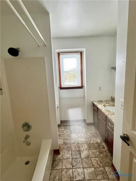 bathroom with vanity and tub / shower combination