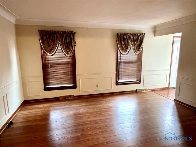 empty room with wood-type flooring