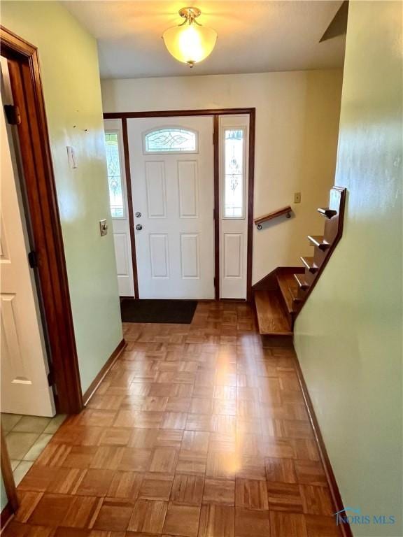 foyer with light parquet floors