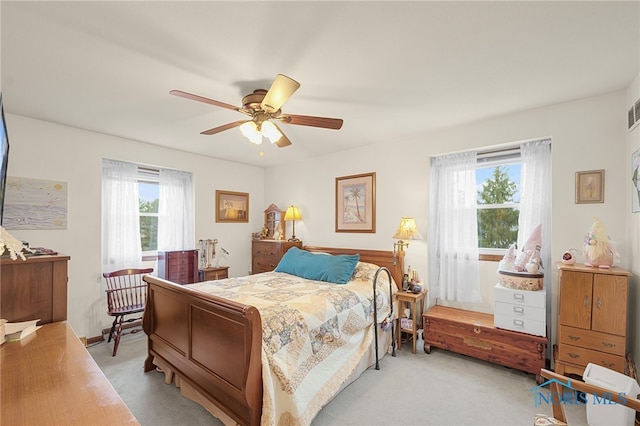 bedroom with light carpet and ceiling fan