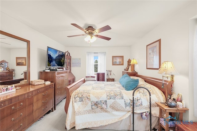 bedroom featuring light colored carpet and ceiling fan