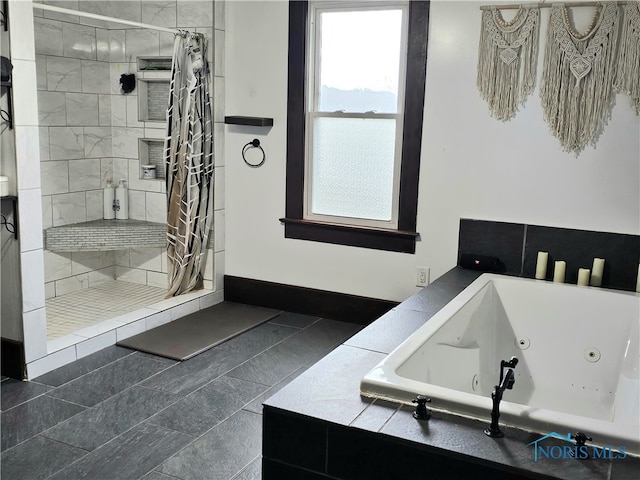 bathroom featuring tile patterned floors and shower with separate bathtub