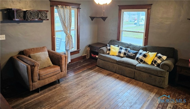 living room with dark hardwood / wood-style flooring