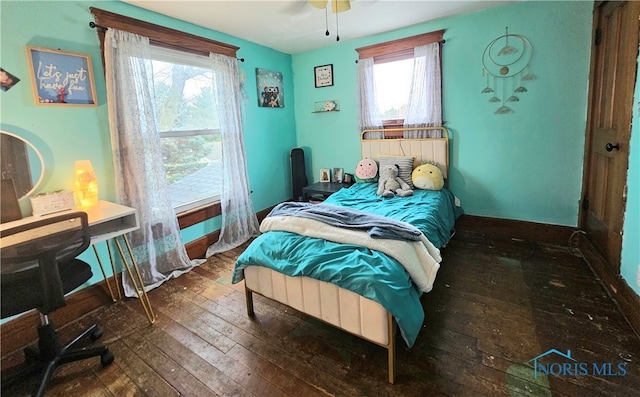 bedroom featuring wood-type flooring and ceiling fan