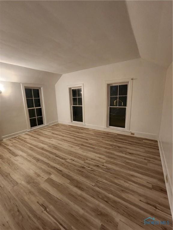 unfurnished room with hardwood / wood-style floors