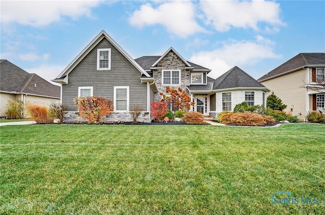 front facade featuring a front yard