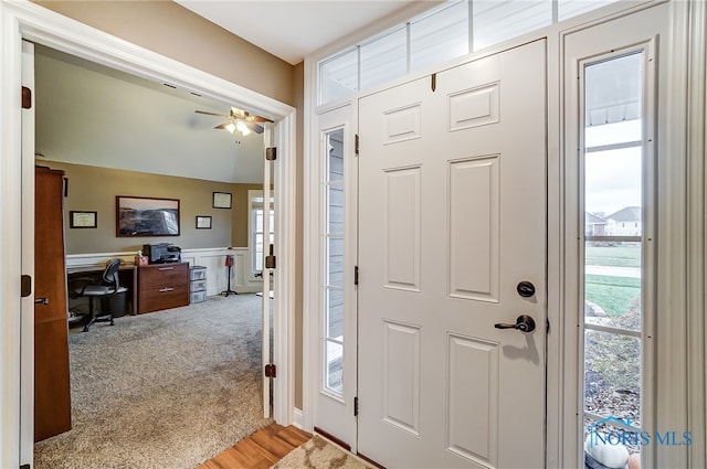 foyer featuring ceiling fan and light hardwood / wood-style floors