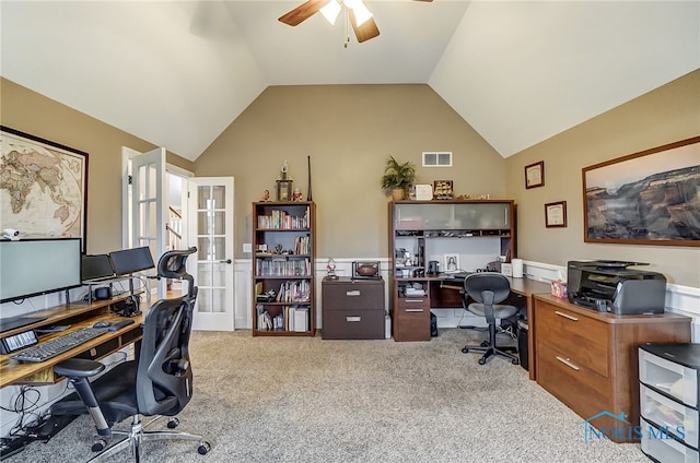 home office with ceiling fan, light colored carpet, french doors, and vaulted ceiling