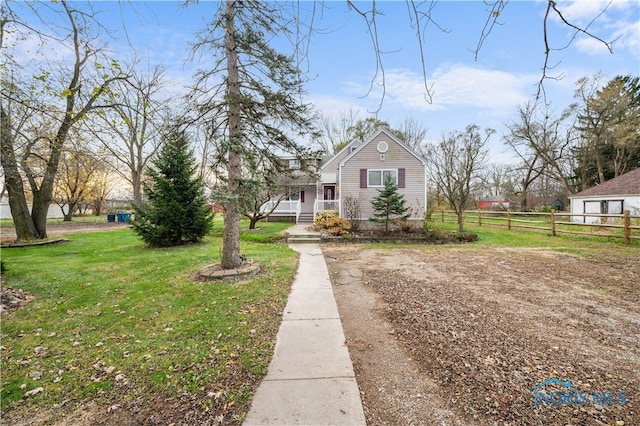 bungalow-style home with a front yard