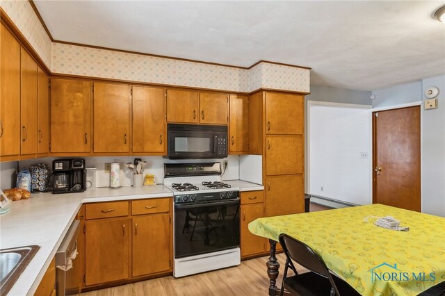 kitchen with stainless steel dishwasher, white gas stove, baseboard heating, and light hardwood / wood-style flooring