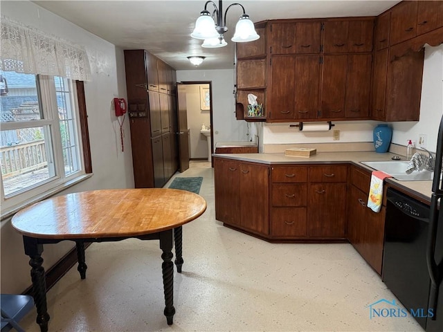 kitchen featuring pendant lighting, dark brown cabinetry, black dishwasher, and an inviting chandelier