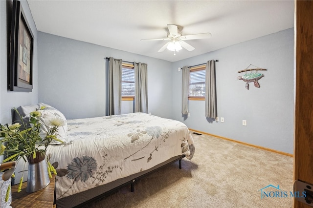 bedroom with ceiling fan and carpet