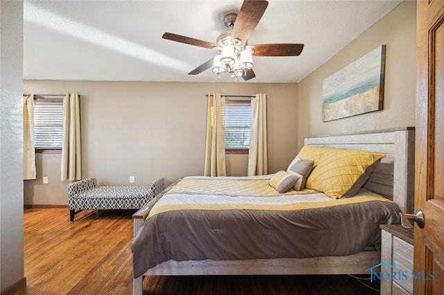 bedroom featuring hardwood / wood-style flooring and ceiling fan