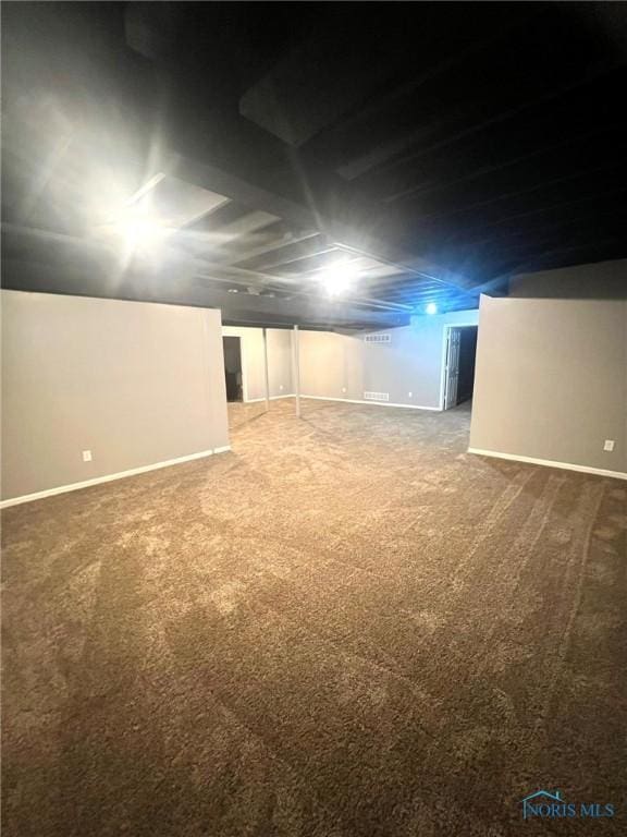 basement with carpet flooring