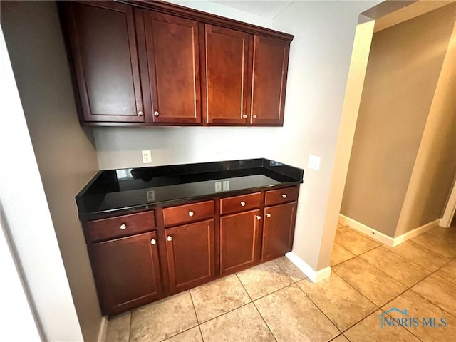 kitchen with light tile patterned flooring