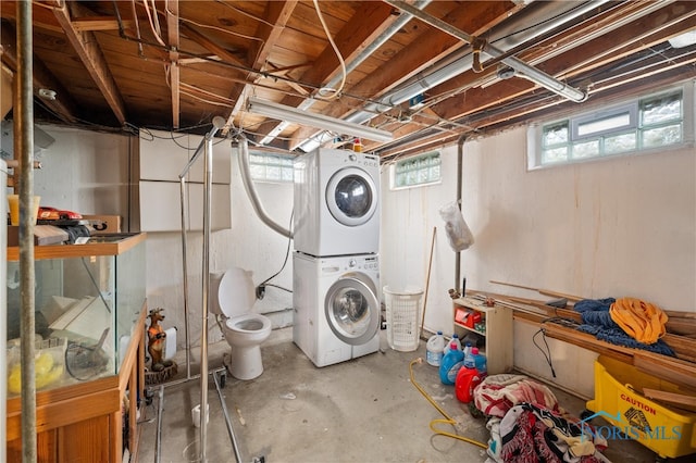 basement with stacked washer / dryer