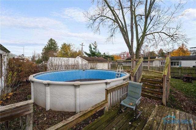 view of swimming pool featuring a wooden deck