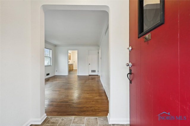 corridor featuring wood-type flooring