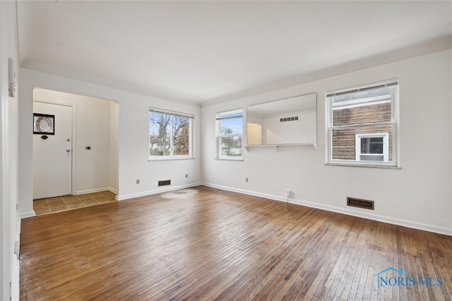 empty room featuring hardwood / wood-style flooring