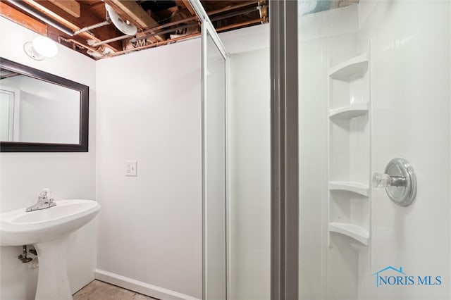 bathroom with a shower and sink