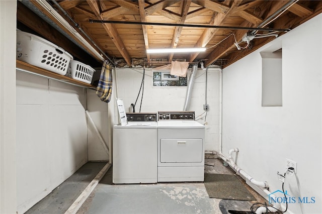 washroom featuring washer and dryer