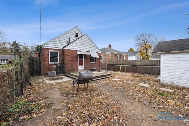 back of property with a wooden deck