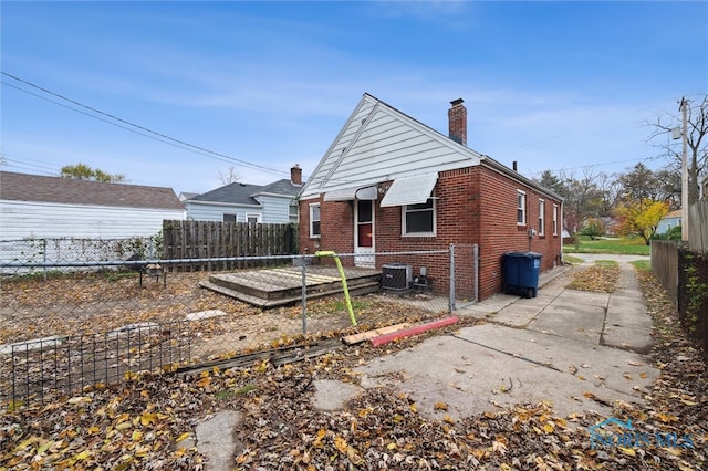 back of house with cooling unit