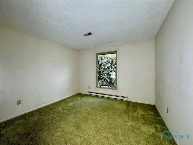 carpeted spare room featuring a baseboard radiator and a textured ceiling