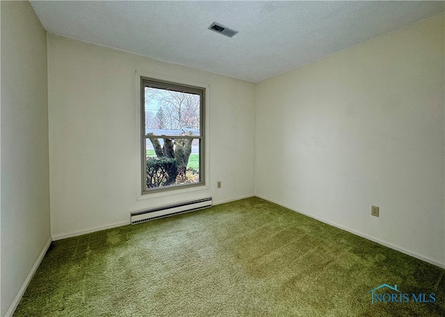 empty room featuring carpet flooring, a textured ceiling, and a baseboard heating unit