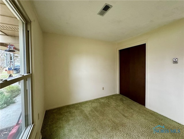 view of carpeted spare room